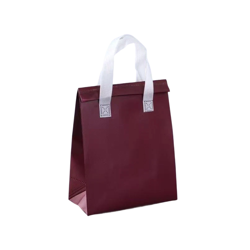 How can we reduce scrap material generation and improve material utilization in the production of non-woven handbags?